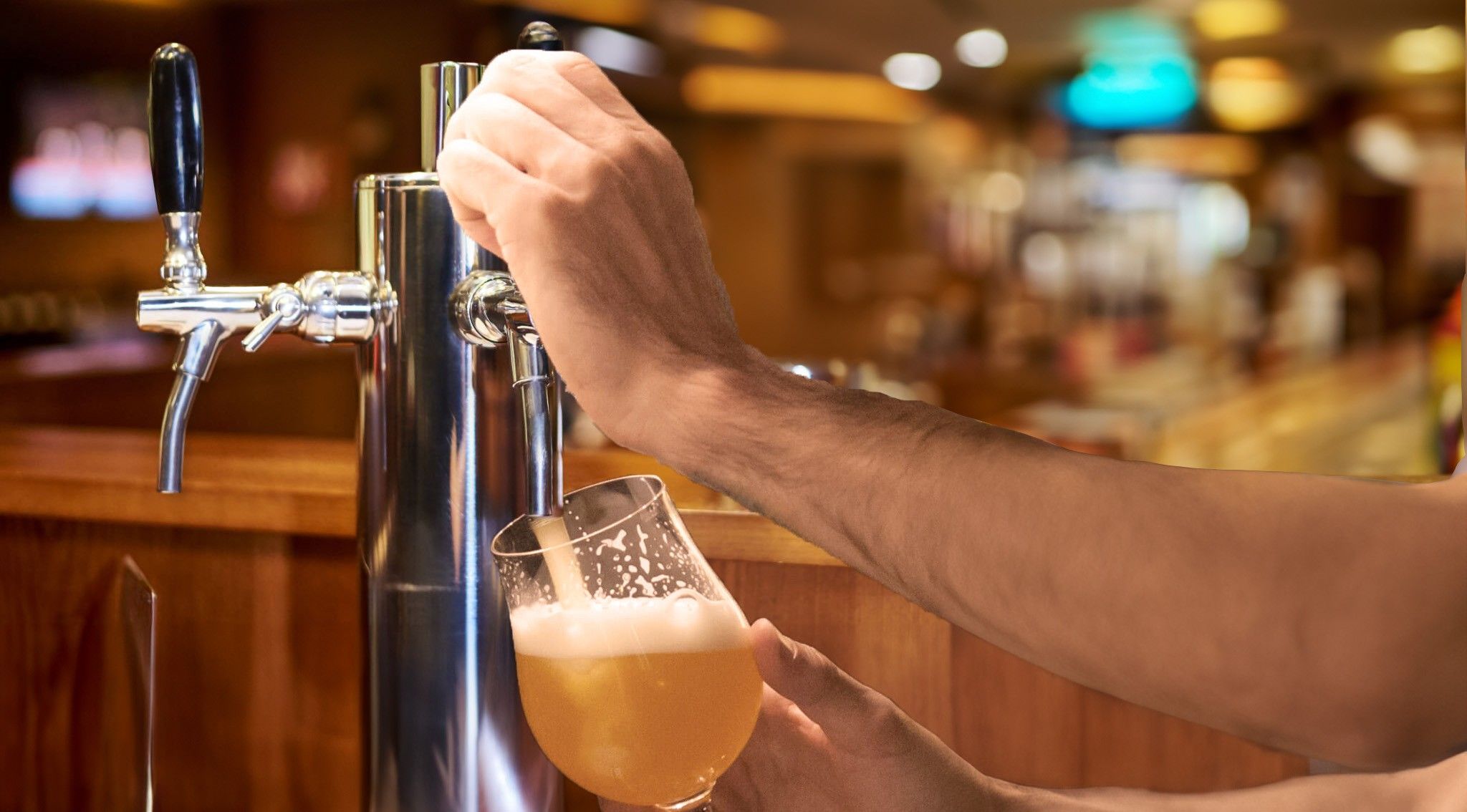 Person pouring beer